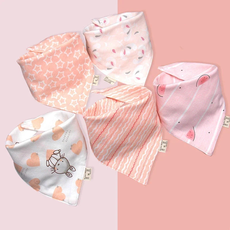 Stylish cotton baby bandana bibs in various fashionable prints, designed to keep your little one dry and comfortable.
