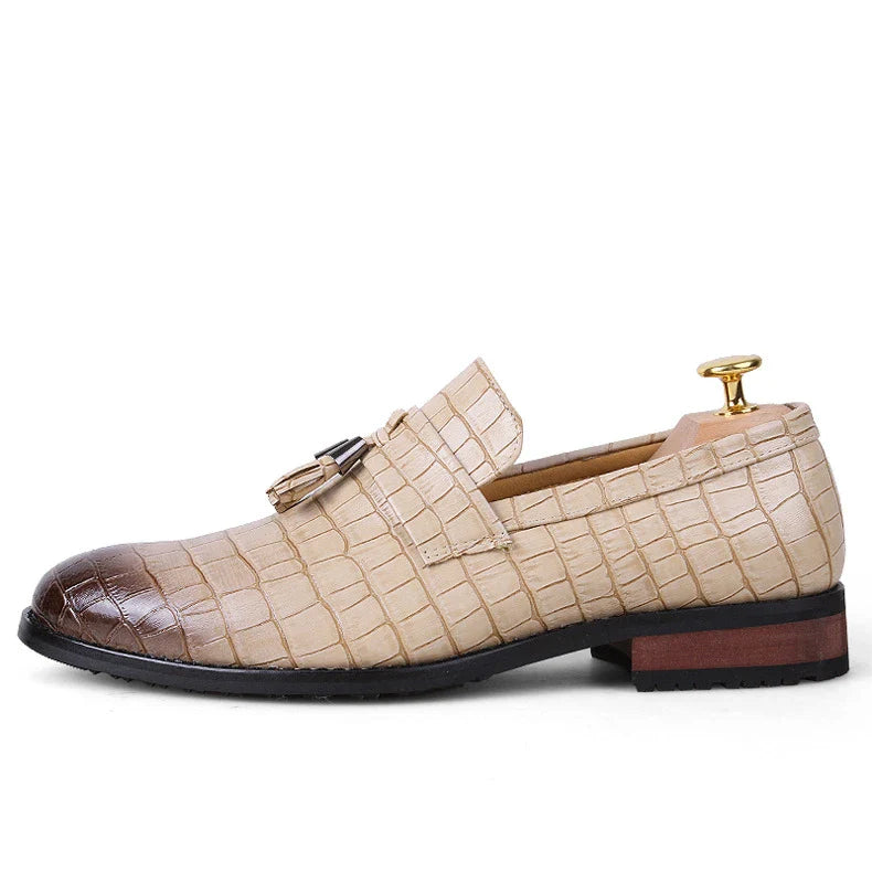 Premium British-crafted men's pointed leather dress shoes with tassels in black color