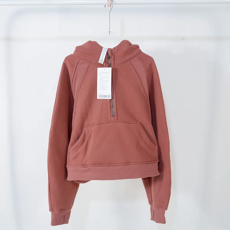 Premium women's sports fleece hoodie with half zip, available in a range of sophisticated colours