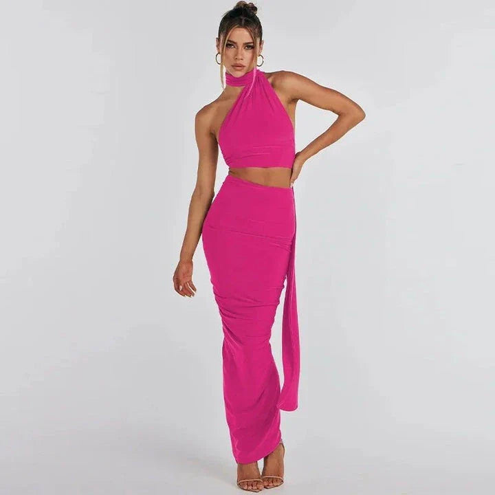 Glamorous backless cocktail dress set with halter-neck crop top and flowing maxi skirt in green colour