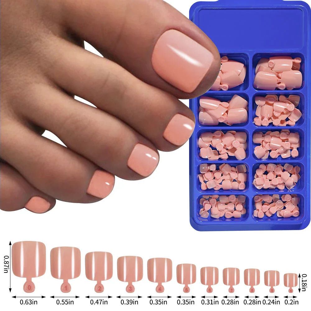 Elegant short square press-on toenails in vibrant pink, red, and nude shades for a polished and convenient pedicure
