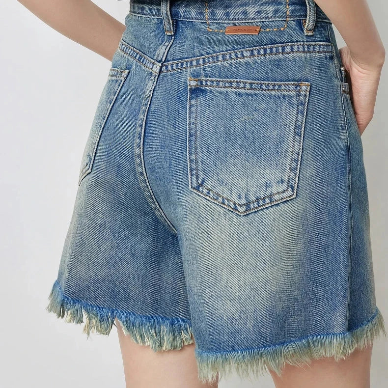 Vintage-inspired high-waisted denim shorts with tassel detailing for women