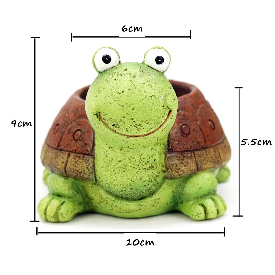 A charming, hand-painted resin planter in the shape of a cartoon turtle, perfect for displaying succulents, cacti, and other small plants.