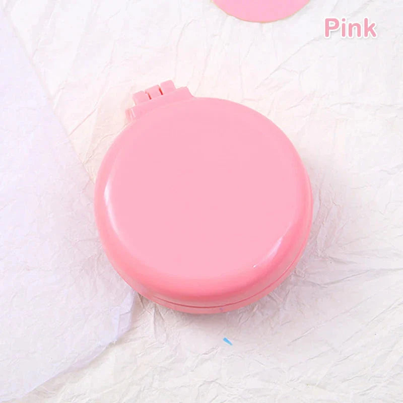 Compact folding hair comb with mirror, perfect for on-the-go touch-ups and styling for British customers