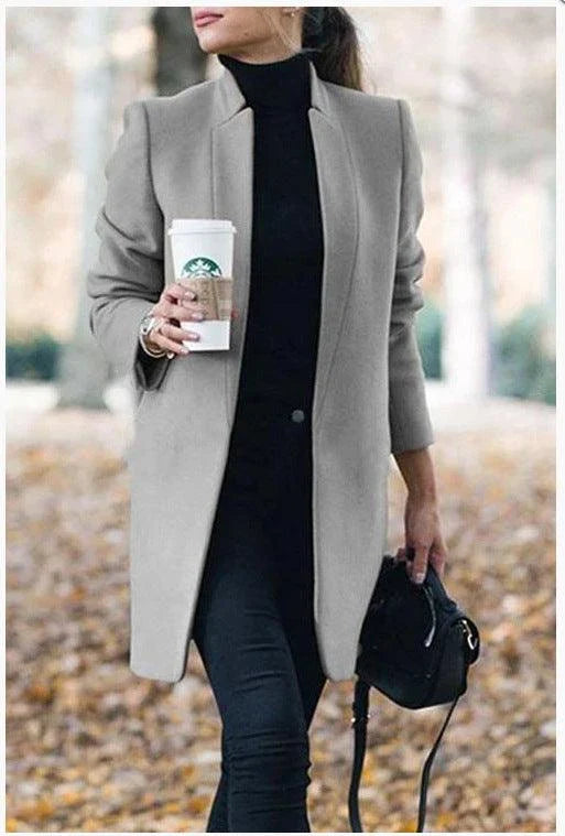 Premium British woollen coat with stand collar, featuring a sleek, slim-fit silhouette and subtle stitching details