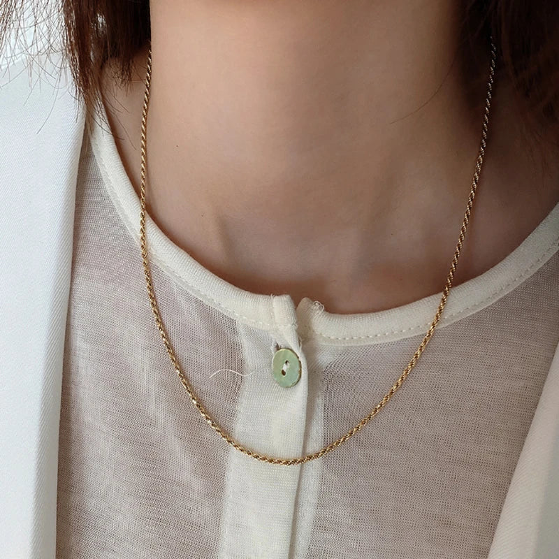 Sterling silver necklace with coastal-inspired fried dough twist design, handcrafted in the UK