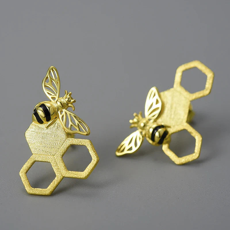 Elegant sterling silver beehive-inspired stud earrings with a nature-inspired design, perfect for fashion-conscious women