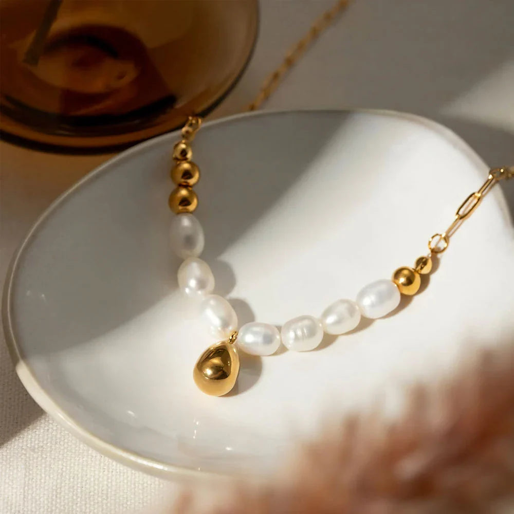 Elegant pearl pendant necklace with luxurious gold drop, a timeless accessory for any occasion