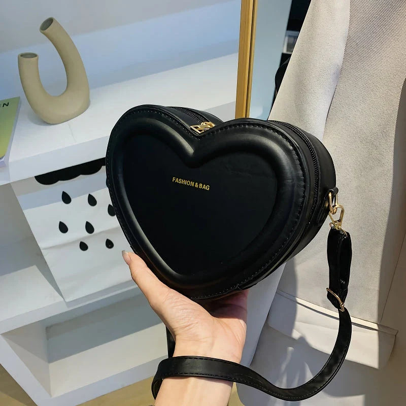 Chic heart-shaped crossbody bag made from premium PU leather, available in multiple stylish colours