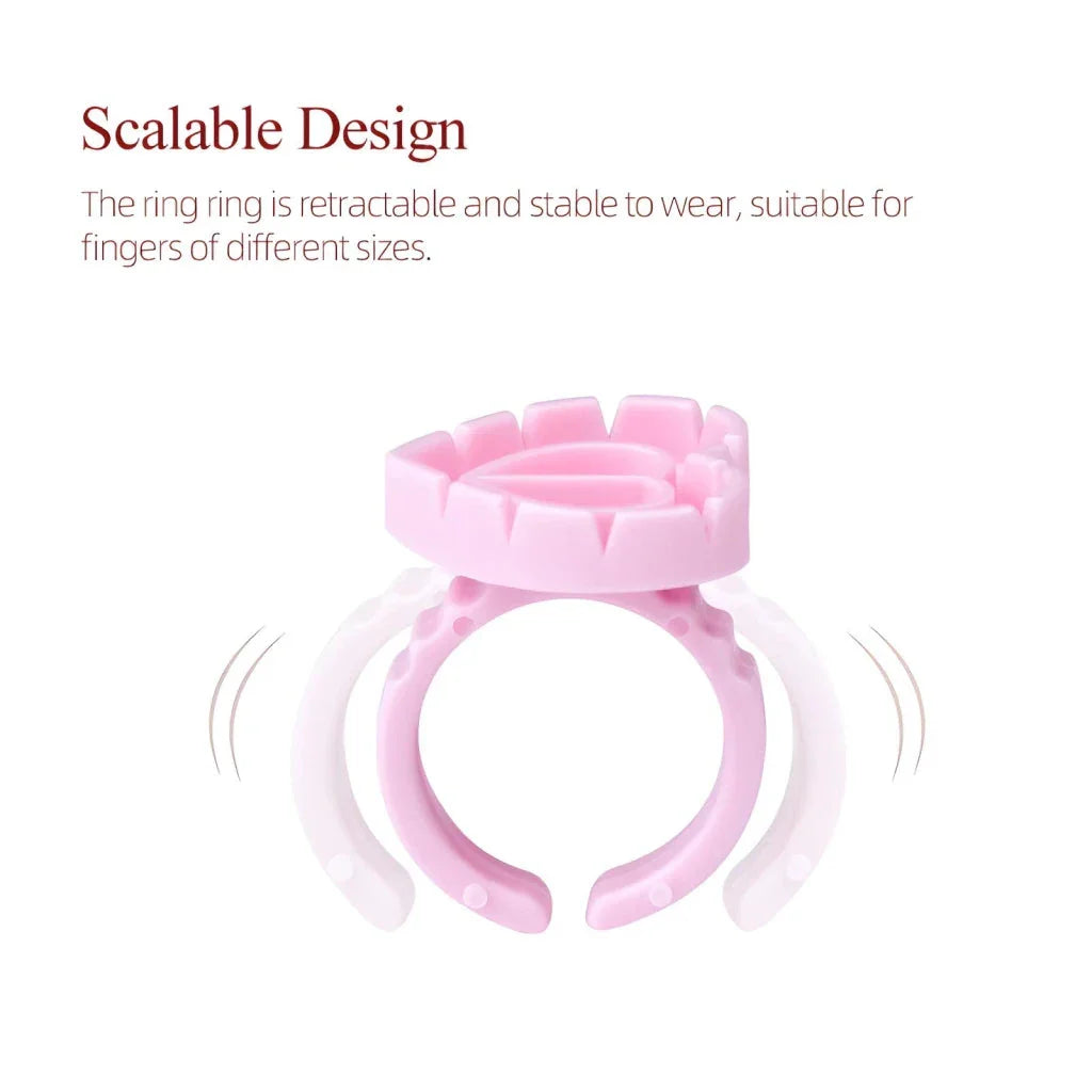 Heart-shaped disposable eyelash glue rings in blue, pink, and white colours