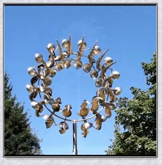 Elegant wind-powered kinetic sculpture with dual-motion blades and metallic construction, creating a mesmerizing visual display in any outdoor setting