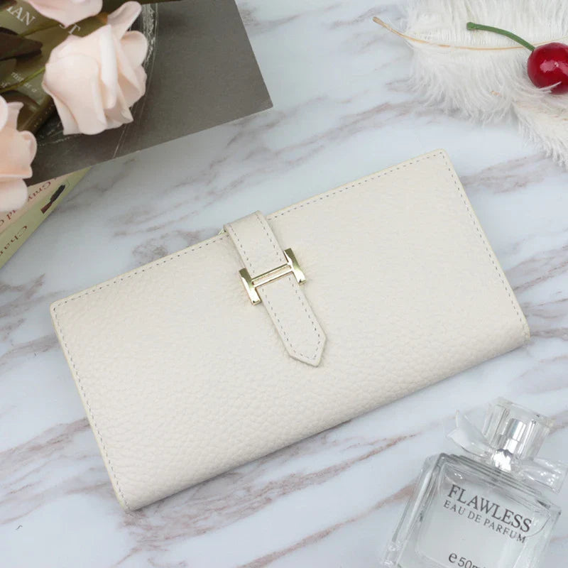 A stylish and practical long wallet made from premium leather, featuring a convenient drawstring closure to keep your essentials organised and secure.