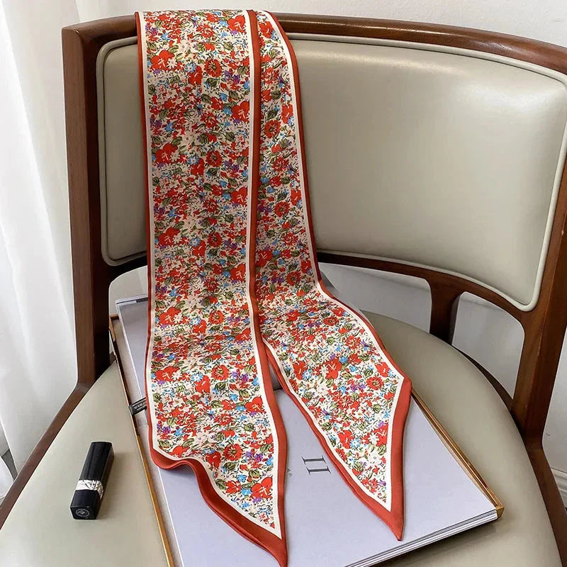 Elegant floral print polyester scarf with a soft, cotton-like texture for versatile seasonal wear