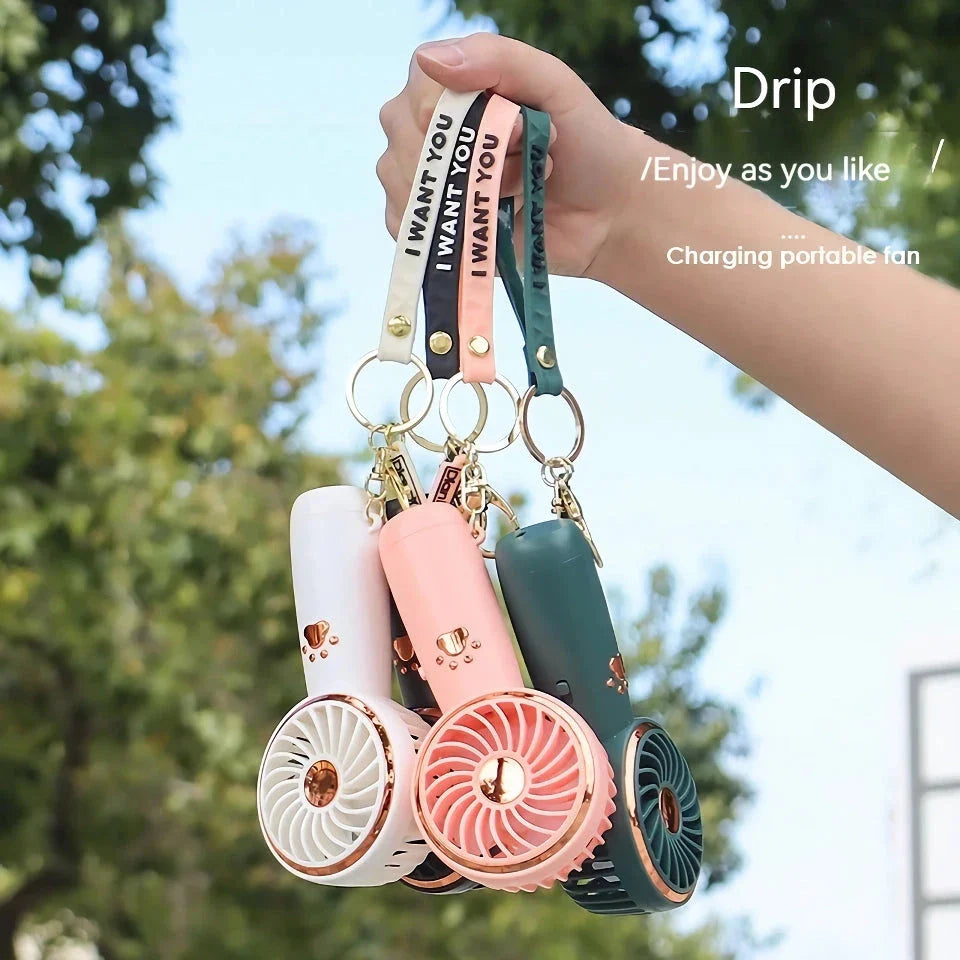 Compact, cartoon-themed USB handheld fan for keeping cool during the summer months