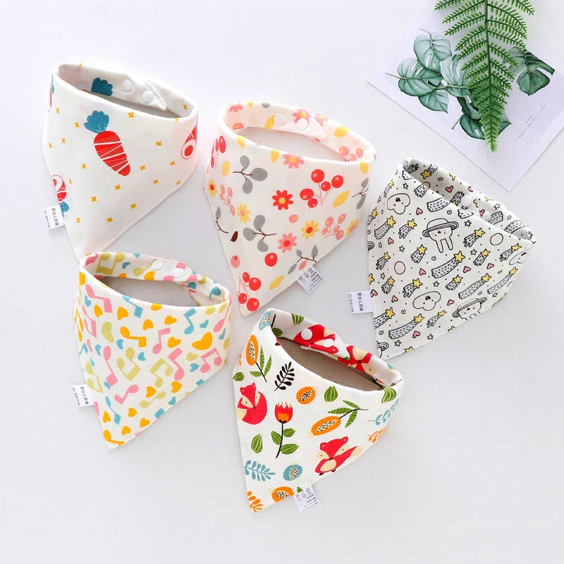 Stylish cotton baby bandana bibs in various fashionable prints, designed to keep your little one dry and comfortable.