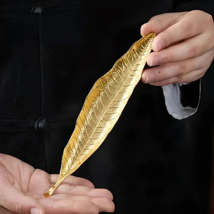 Elegantly crafted copper alloy incense holder with Bodhi leaf design, perfect for meditation and home decor