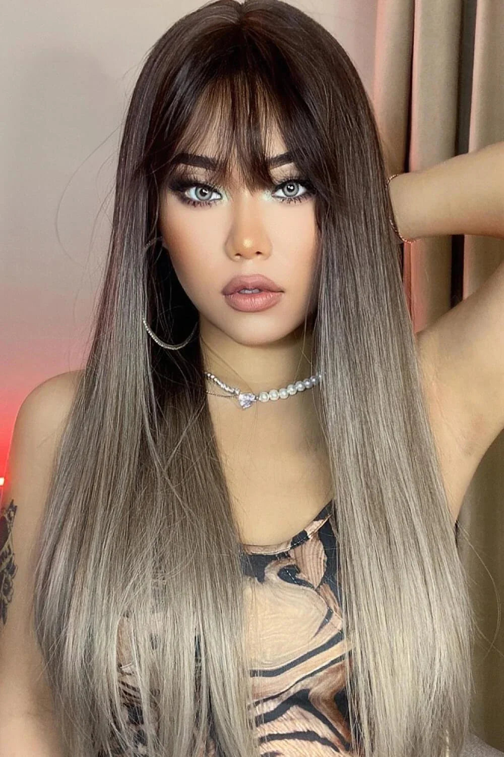 Stylish long straight synthetic wig with a comfortable cap and heat-safe design for versatile hair transformation