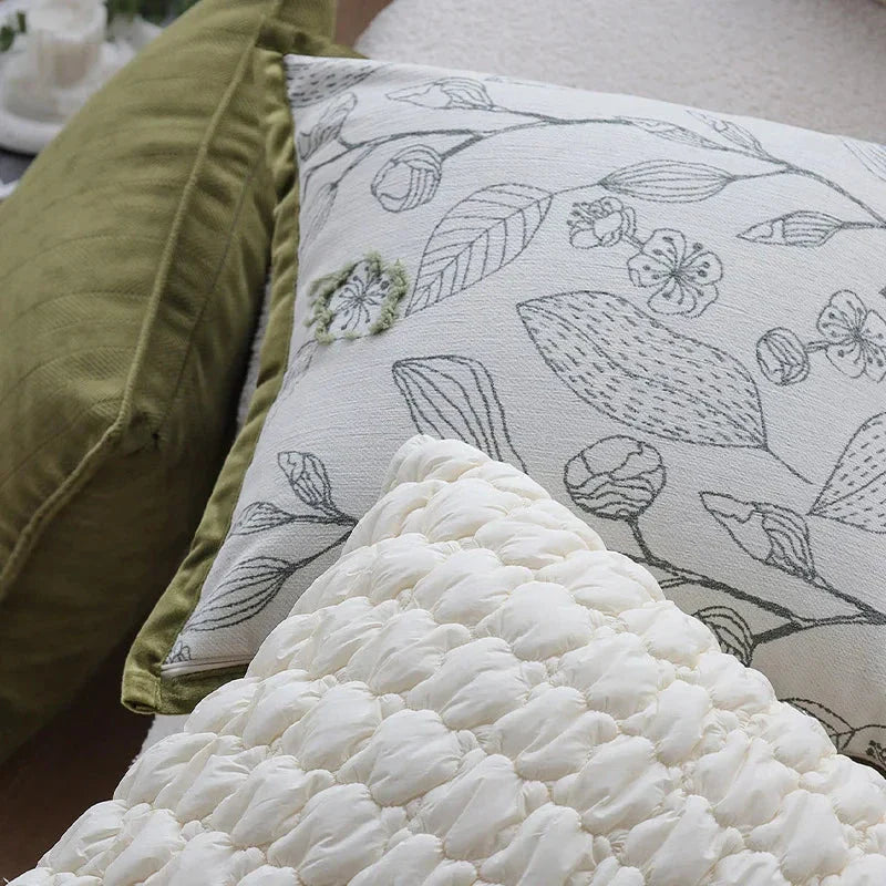 Luxurious cream and green jacquard cushion cover with a unique pattern, measuring 45 x 45 cm for a generous size and impactful presence.