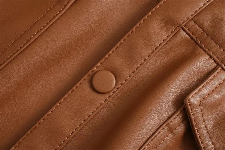 Stylish British-made faux leather jacket with stitching details and adjustable belt for a customized fit