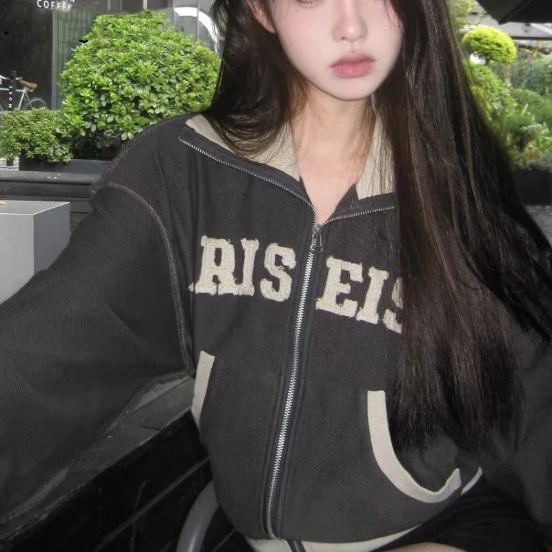 A premium retro-inspired women's sweater jacket made of high-quality polyester with a loose, comfortable fit and a timeless design.