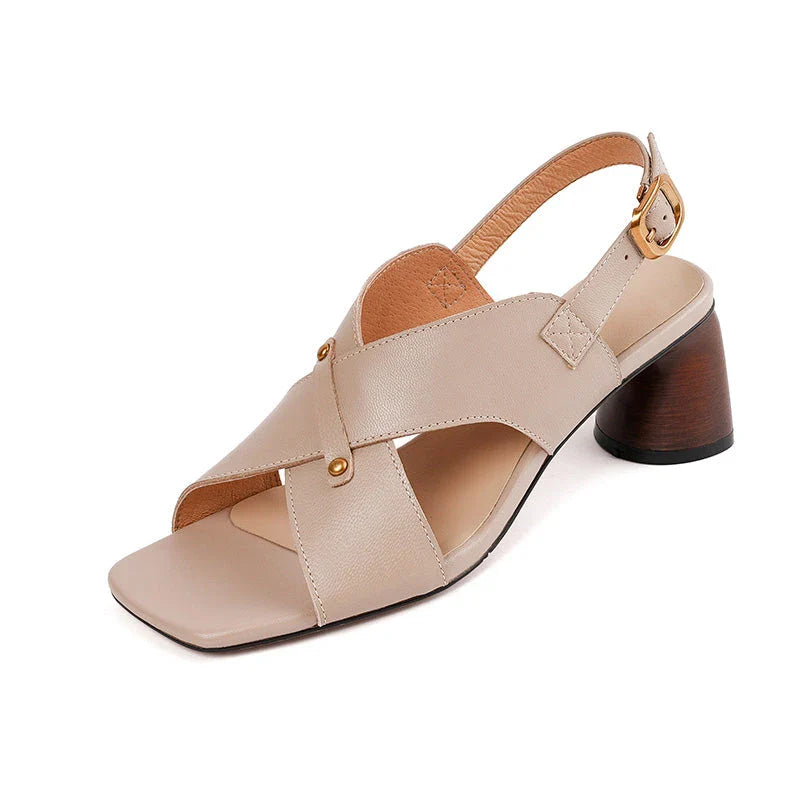 Elegant leather high heel sandals for women, featuring a refined square heel, stylish buckle strap, and sleek design for a sophisticated look.