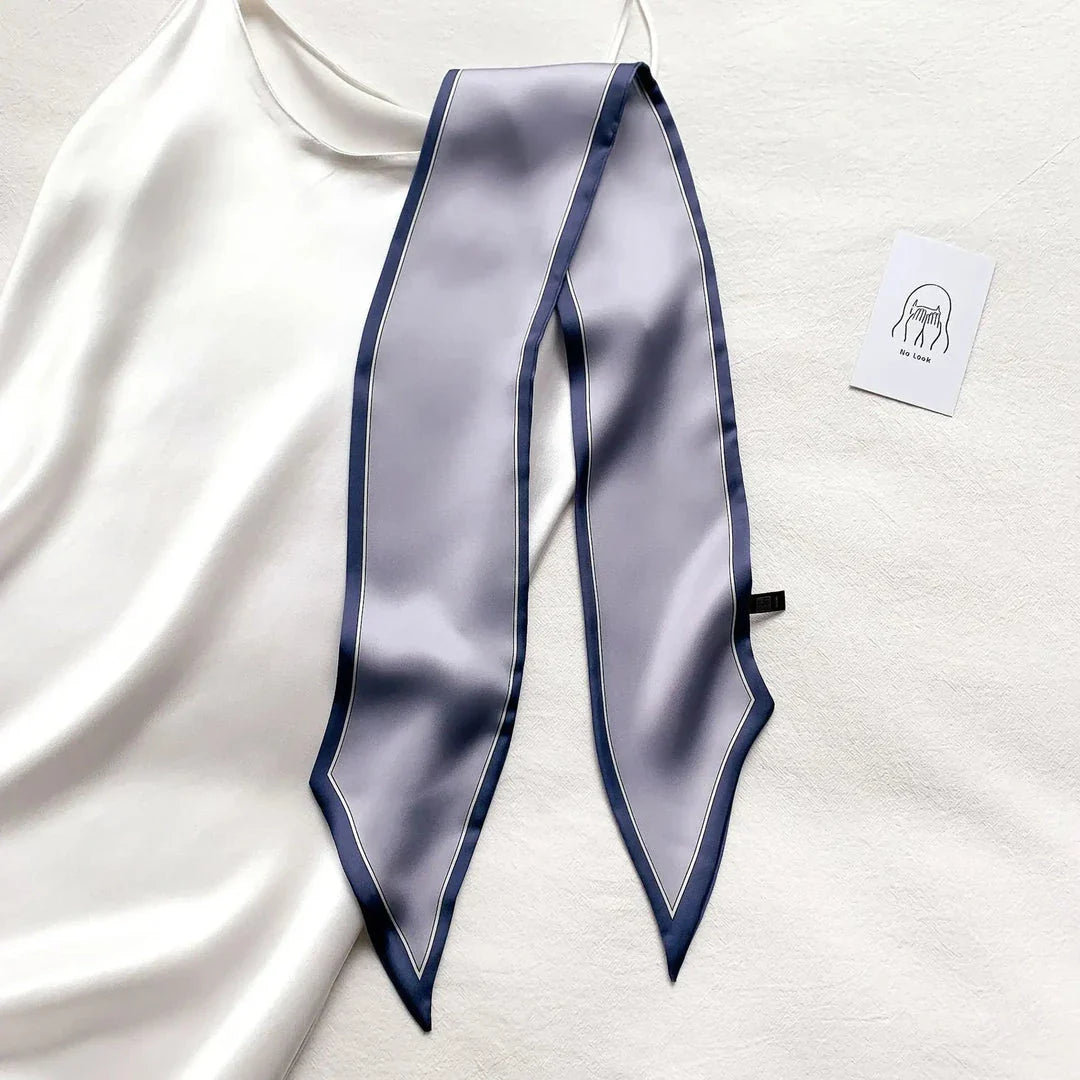 Luxury silk-feel narrow scarf in blue colour, a versatile fashion accessory for the modern British woman