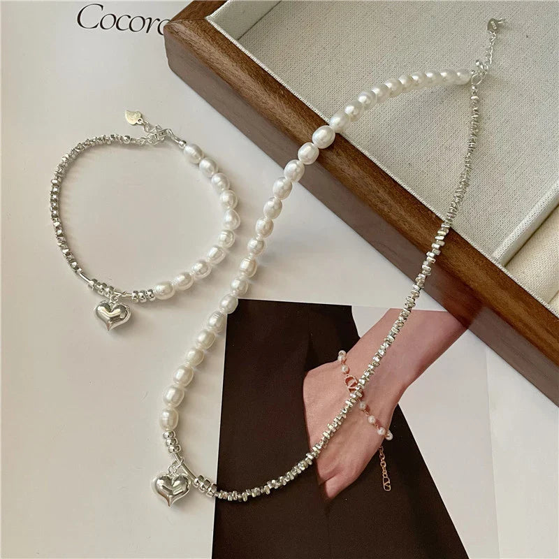 Elegant heart-shaped pearl necklace in sterling silver, a timeless British-inspired accessory