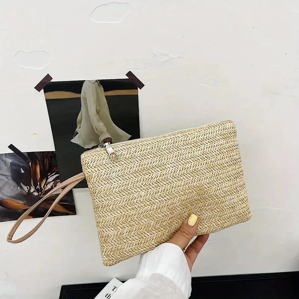 A natural straw-woven clutch with a zipper closure, perfect for summer outings in the UK.