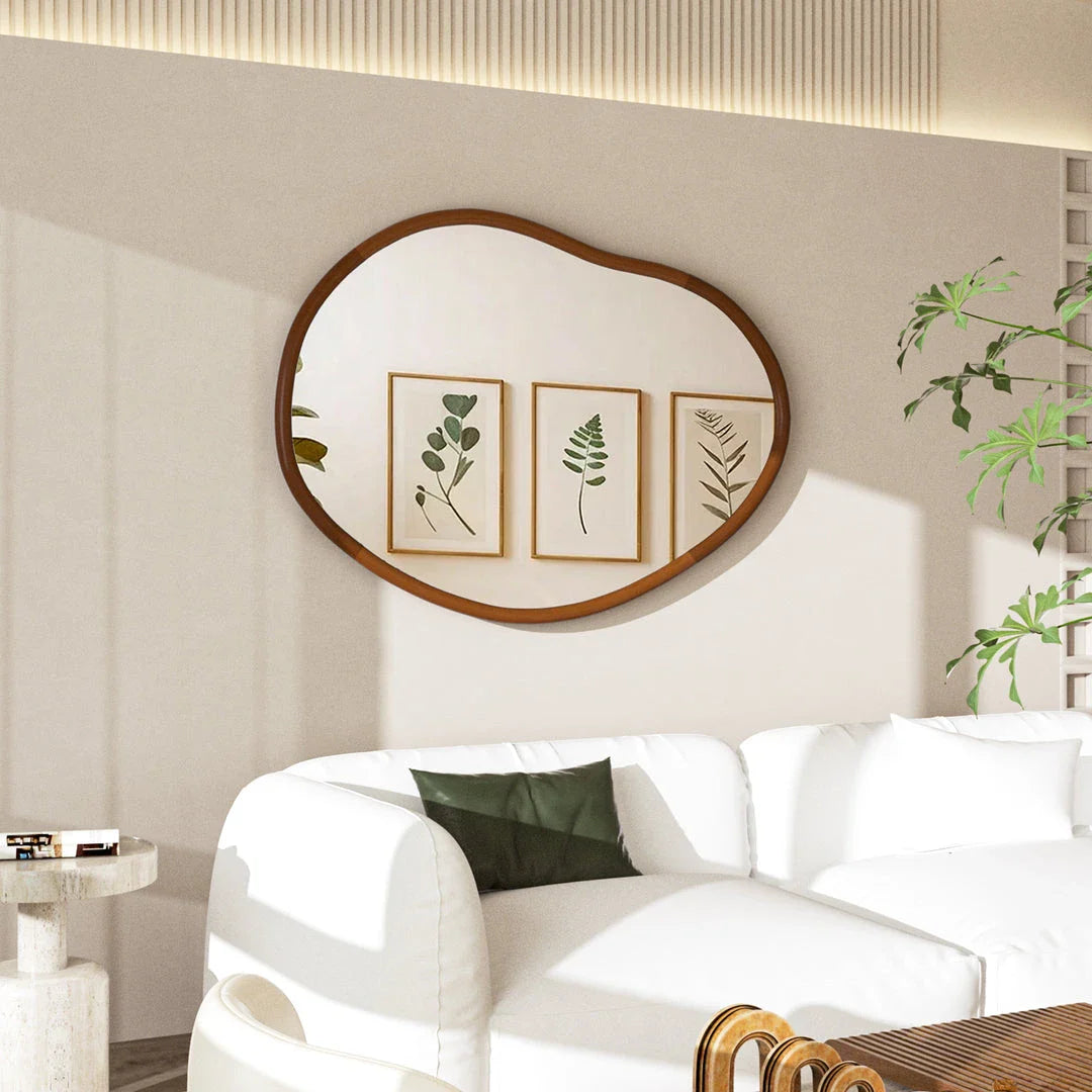 Stylish mid-century asymmetric decorative wall mirror with solid beech wood frame, adding visual interest and reflecting light to create a brighter, more open living space.