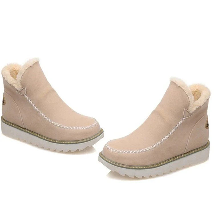 A pair of stylish, non-slip snow boots with a warm artificial wool lining, perfect for British winter weather