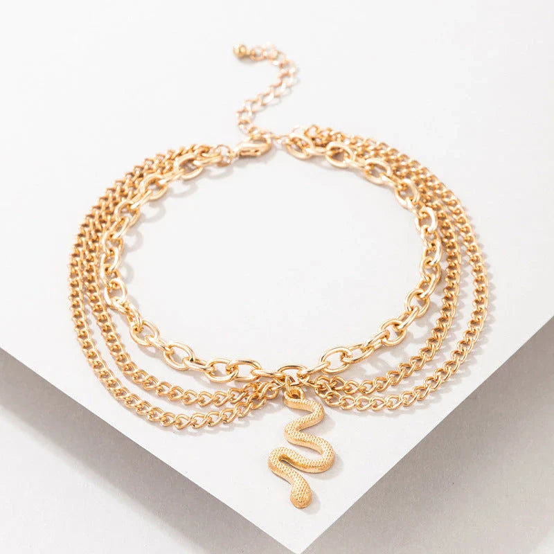 A stylish gold boho anklet with delightful tassels, starfish, and heart charms, perfect for summer outings and everyday wear.
