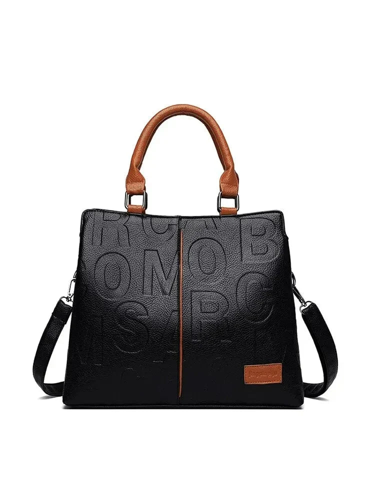 Sophisticated large leather tote bag with embossed lettering design, suitable for daily use and travel