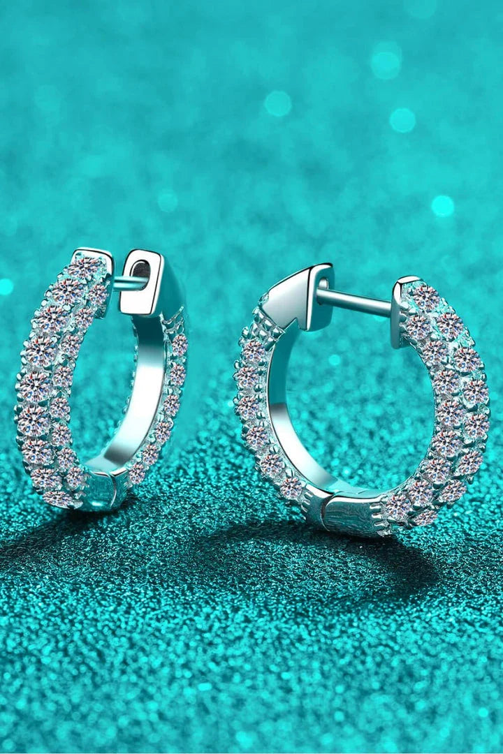 Elegant 925 sterling silver moissanite huggie earrings with a minimalist design and polished finish