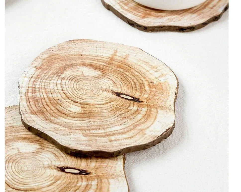 Set of 6 premium wooden coasters in oak and walnut finishes, designed to protect surfaces from water damage and enhance the ambiance of any space.