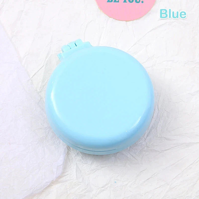 Compact folding hair comb with mirror, perfect for on-the-go touch-ups and styling for British customers