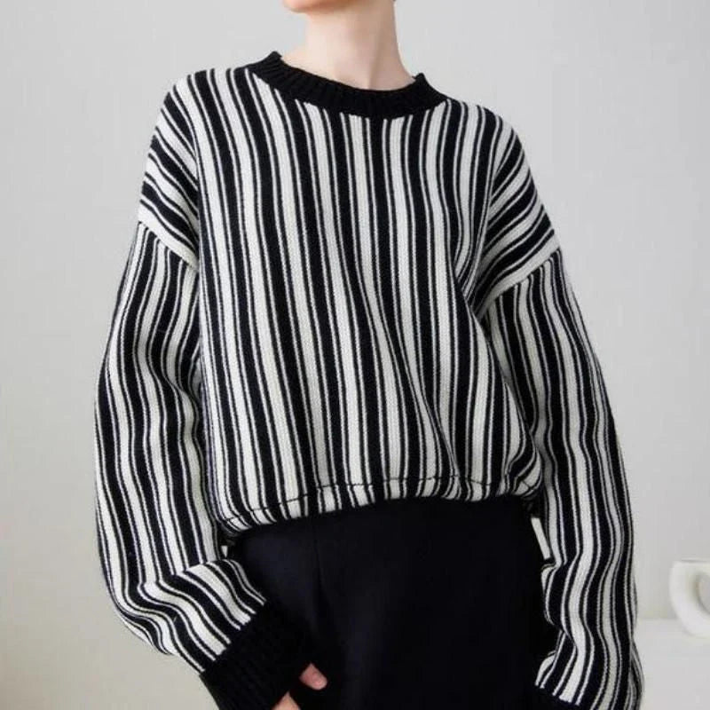 A chic striped wool-blend jumper in black, featuring an elegant O-neck design and a relaxed, flattering fit