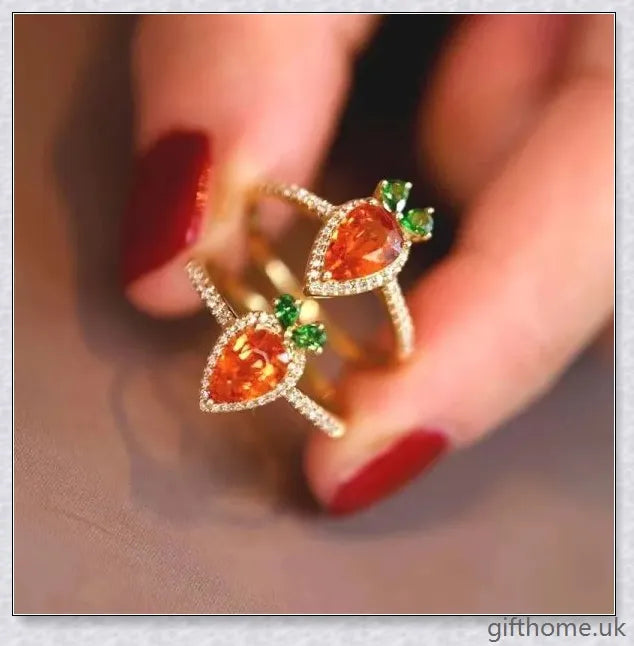 A close-up image of a charming copper ring with a carrot-shaped design and delicate micro-inlaid detailing.