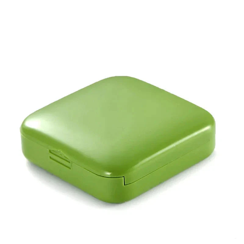 Compact and portable 2-grid mini pill box made of durable ABS plastic for organised medication storage