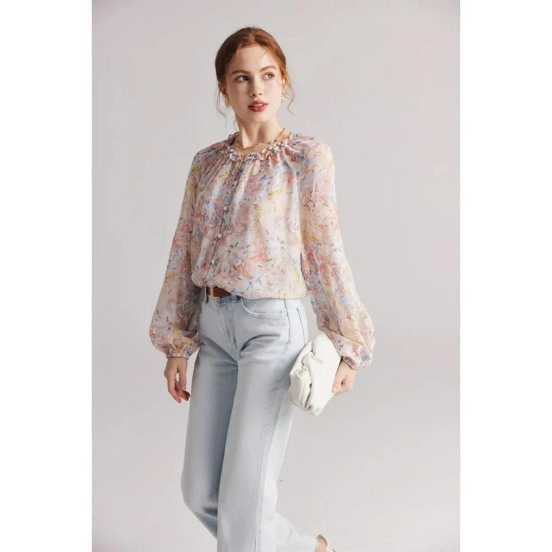 Floral silk blouse with ruffles and round neckline, showcasing the elegant and comfortable design for versatile wear.