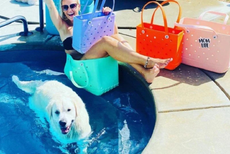Premium waterproof beach tote bag in various vibrant colours, featuring spacious main compartment and multiple pockets for organised storage