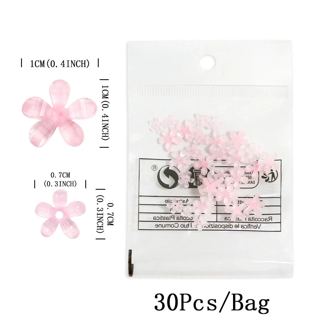 Elegant 3D flower nail charms in white and pink colours, featuring a transparent jelly finish and rhinestone accents for a stylish manicure