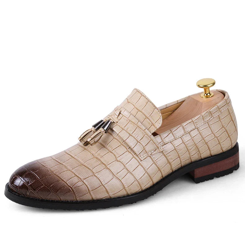 Premium British-crafted men's pointed leather dress shoes with tassels in black color