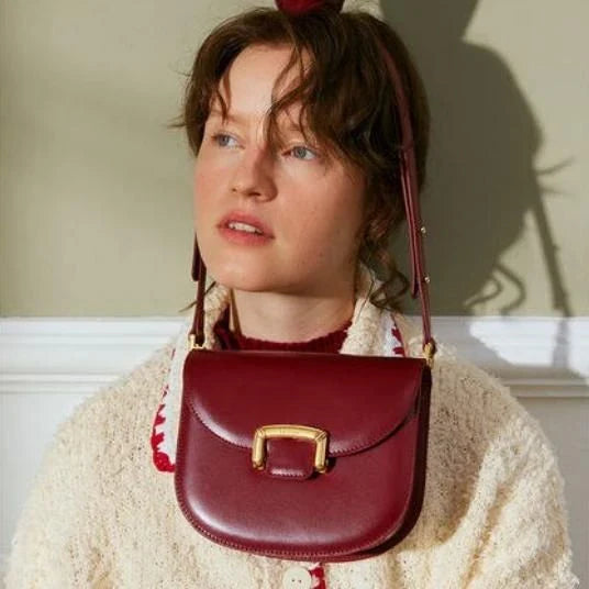 Premium high-end British wedding shoulder bag in brown, with a unique saddle shape design and hardwearing leather exterior
