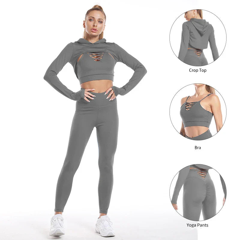A 3-piece sports set including a hooded top, sports bra, and high-waisted leggings in a black colour scheme.