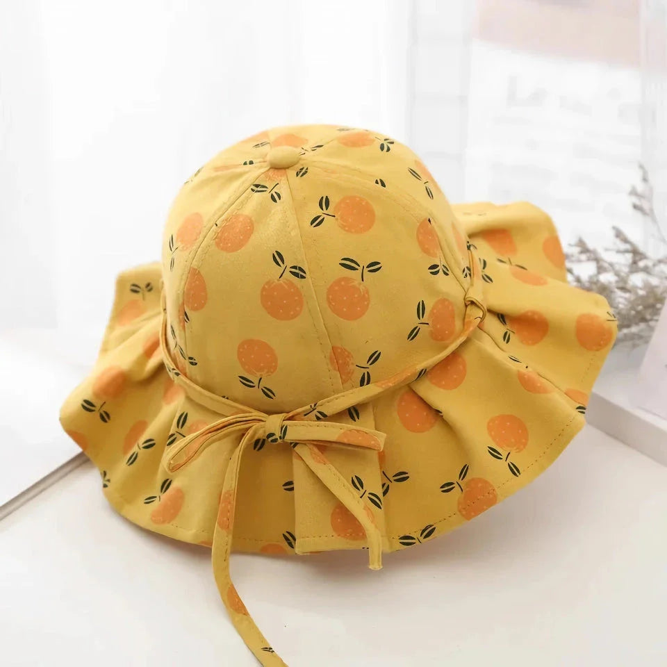 Adjustable white cotton sun protection bucket hat with cartoon pattern for children