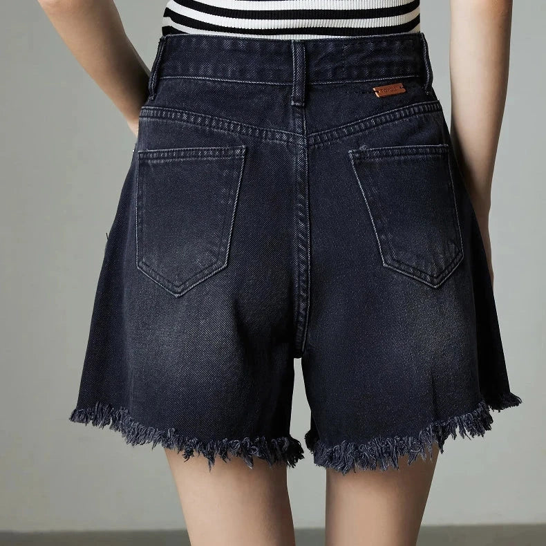 Vintage-inspired high-waisted denim shorts with tassel detailing for women