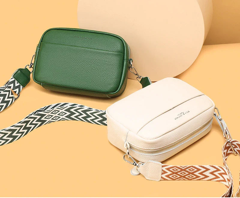 Stylish leather crossbody bag with embroidered strap in various colours