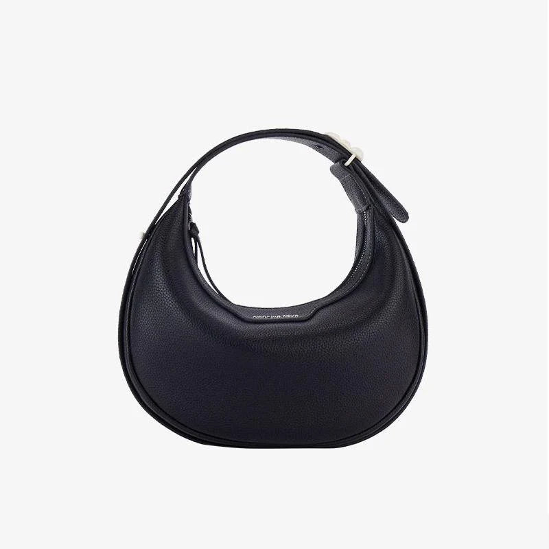 Stylish crescent-shaped leather crossbody bag with soft, supple texture for everyday elegance