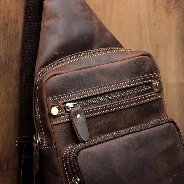 Vintage-inspired genuine leather briefcase with multiple compartments and secure zipper closure, ideal for modern commuters