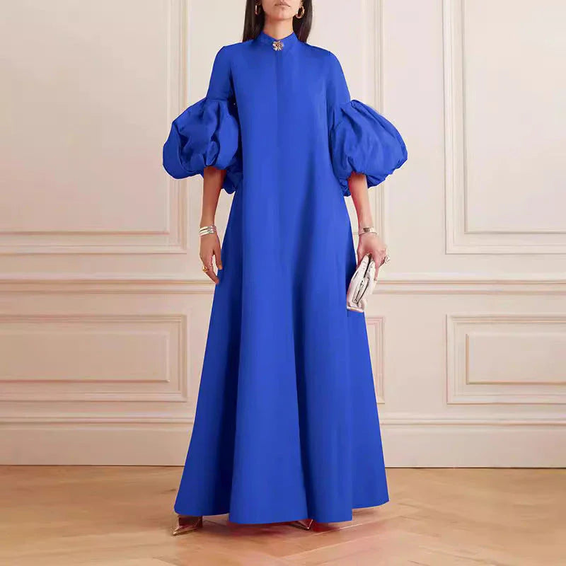 Elegant floral evening gown in a range of vibrant colours, featuring a loose, flattering fit and chic lapel design